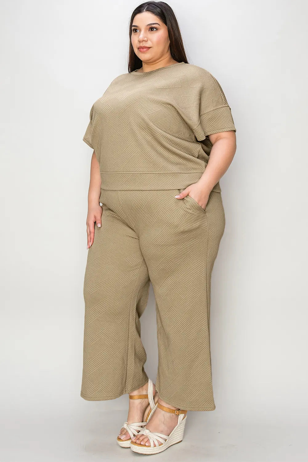 Trendsi Double Take full size texture short sleeve top and matching pants set, casual loungewear with a textured fabric design.