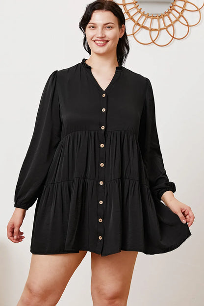 Ruffled button-up long sleeve tiered shirt in soft fabric, featuring a feminine design with ruffles and tiered layers.