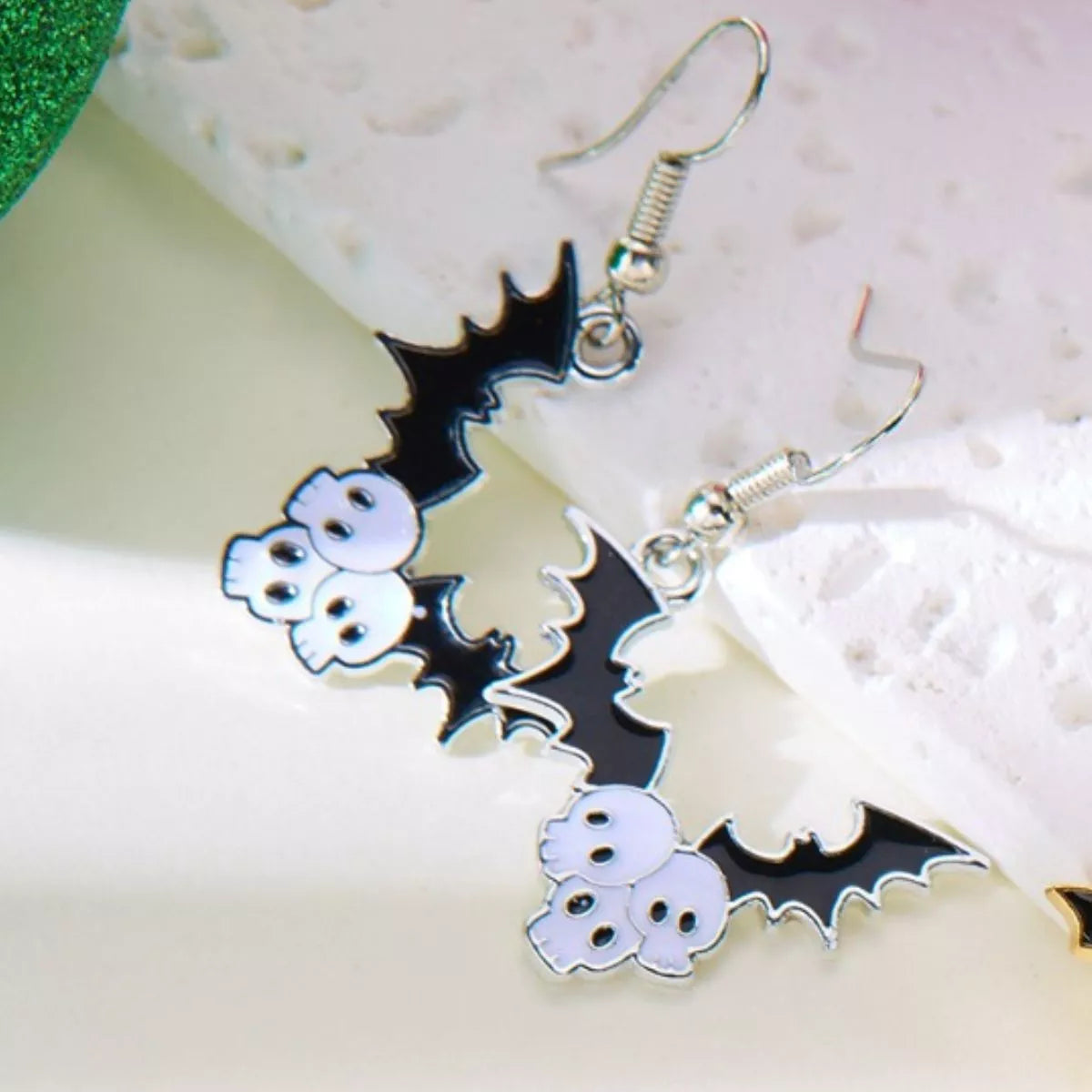 Halloween bat drop earrings featuring black bat-shaped dangles, perfect for spooky season accessories.