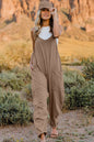 Trendsi Double Take full-size sleeveless v-neck jumpsuit with pockets, shown hanging on a mannequin.