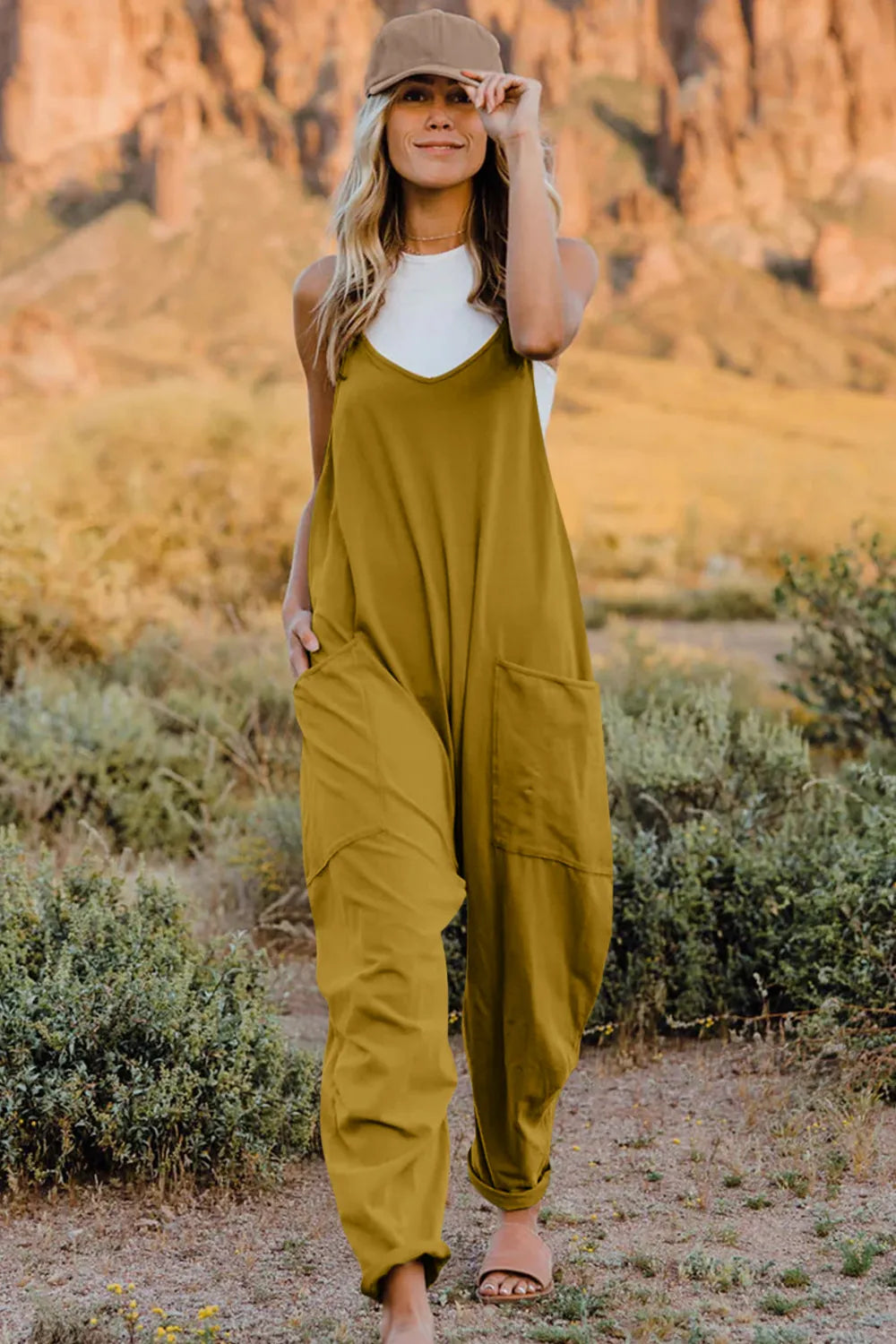 Trendsi Double Take full-size sleeveless V-neck jumpsuit with pockets, showing the front view on a model.