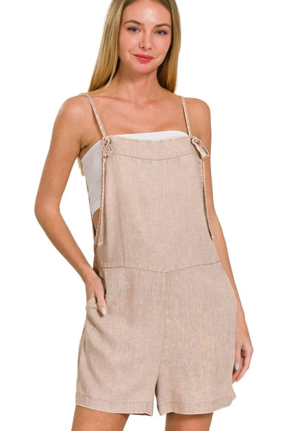 Zenana washed linen knot strap romper, lightweight and stylish, featuring a relaxed fit and tie straps, perfect for casual summer wear.