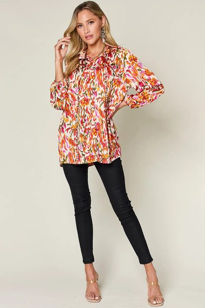 Plus size printed button-up long sleeve shirt from Trendsi, featuring a stylish pattern and comfortable fit.