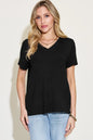 Basic Bae full size V-neck high-low T-shirt by Trendsi, white casual shirt with V-neck and high-low hem, displayed on a hanger.