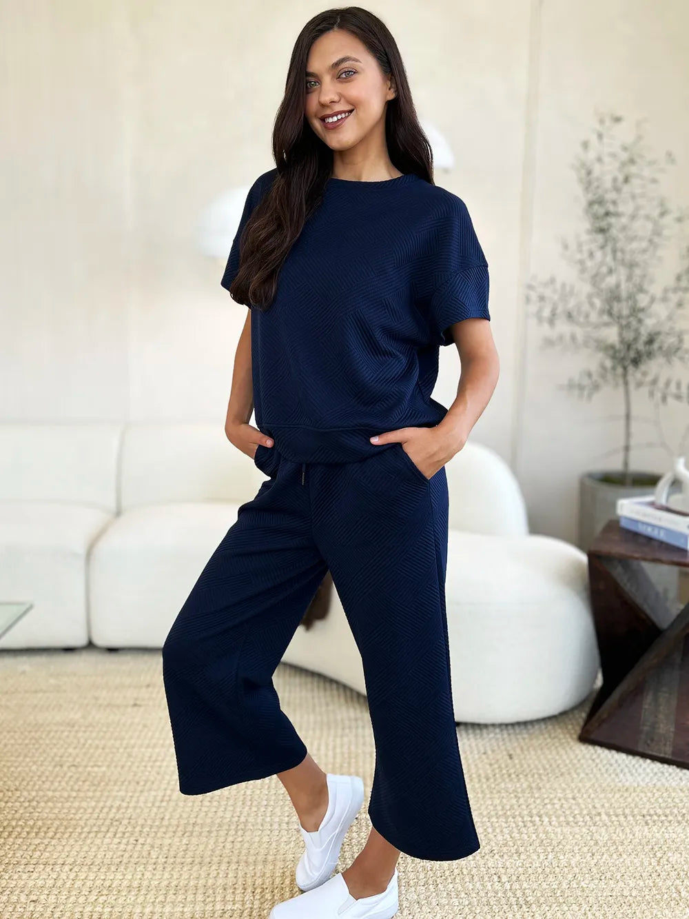 Trendsi Double Take full size textured short sleeve top and matching pants set, stylish and comfortable outfit for casual wear.
