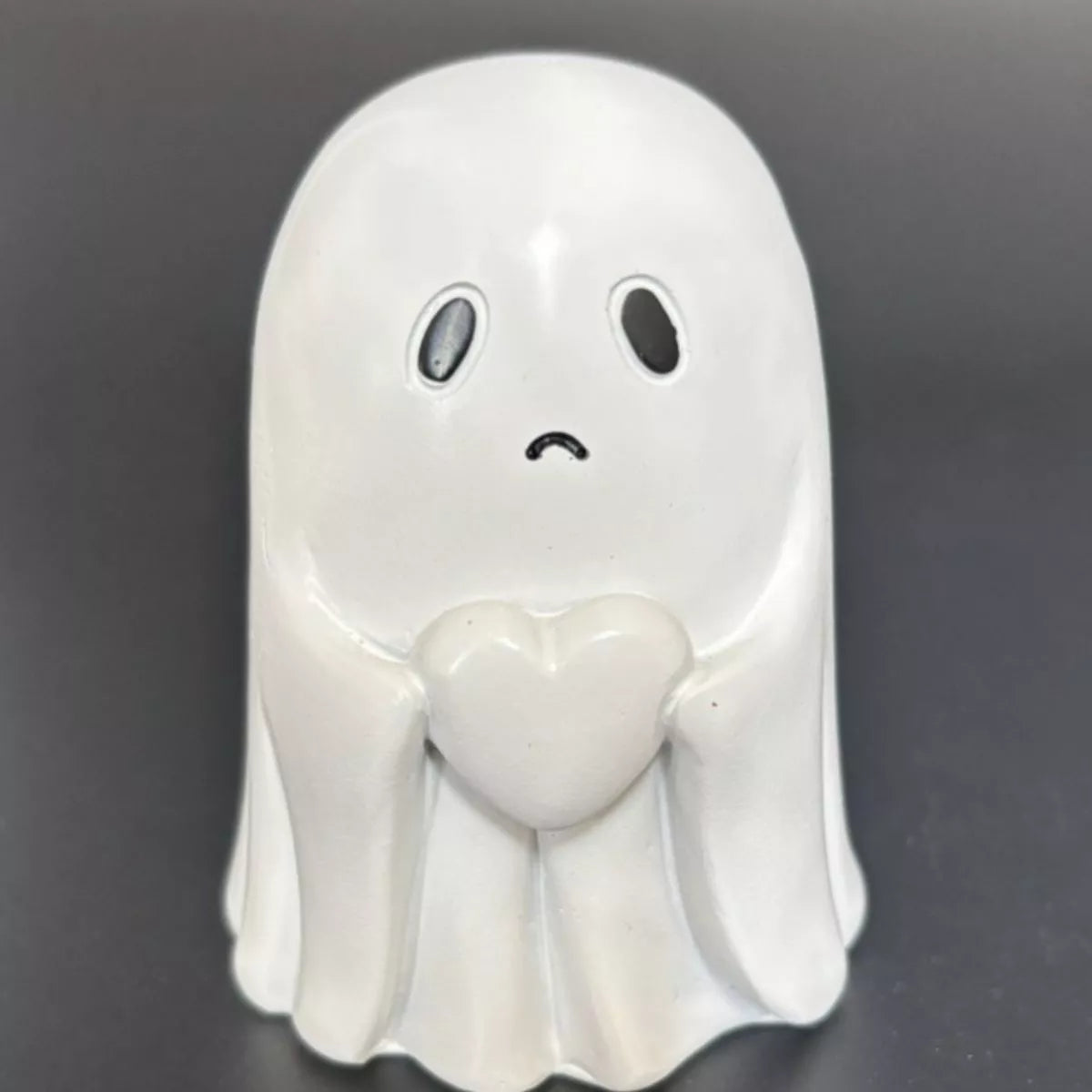 Halloween Ghost Heart decorative ornament by Trendsi featuring a spooky ghost with a heart for Halloween decor.