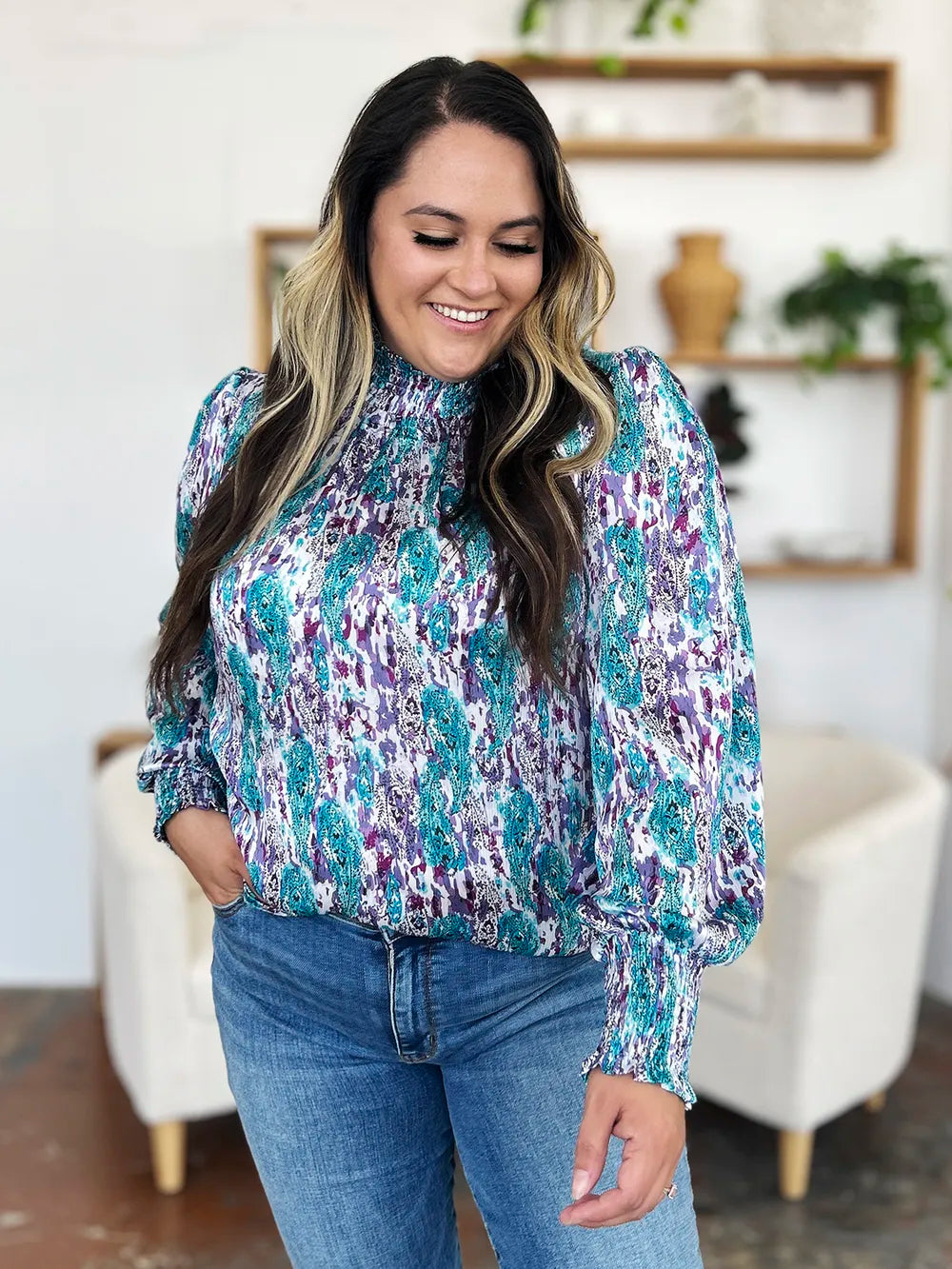 Printed smocked long sleeve blouse from Trendsi featuring a double take full size design and stylish details.