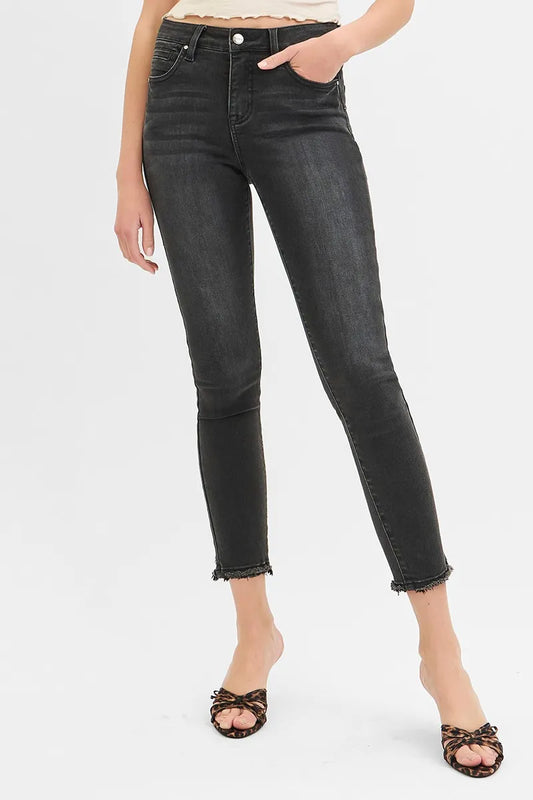 Plus size RISEN skinny jeans with tummy control, mid-rise crop style, by Trendsi, shown in a full-length view.