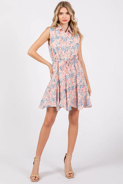 Full size floral eyelet sleeveless mini dress by Trendsi, featuring a fitted bodice, eyelet details, and a flowy skirt.