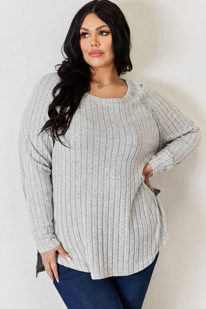 Trendsi Basic Bae full-size ribbed round neck slit T-shirt in neutral color, featuring a fitted ribbed fabric and slit detail.