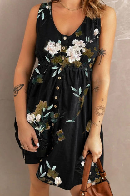 Printed sleeveless casual magic dress by Trendsi featuring front buttons, ruched waist, side slit, and pockets.