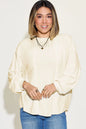 Basic Bae full-size ribbed round neck long sleeve T-shirt by Trendsi, shown in a natural fit with ribbed fabric and long sleeves.