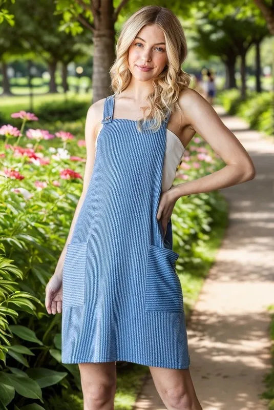 Heimish Plus Size Ribbed Sleeveless Mini Tank Dress in black, featuring a fitted silhouette and sleeveless design.