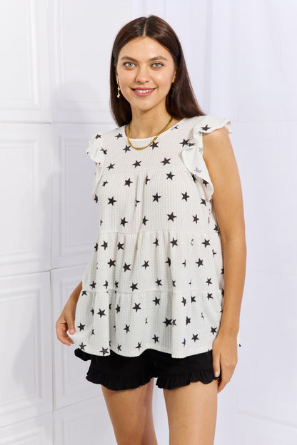 Heimish Shine Bright butterfly sleeve star print top in full size, featuring a stylish design with butterfly sleeves and star patterns.