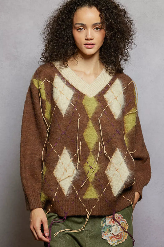 Trendsi POL V-neck mohair sweater with argyle pattern and contrast exposed stitch detail, showcasing its cozy knit fabric and stylish design.
