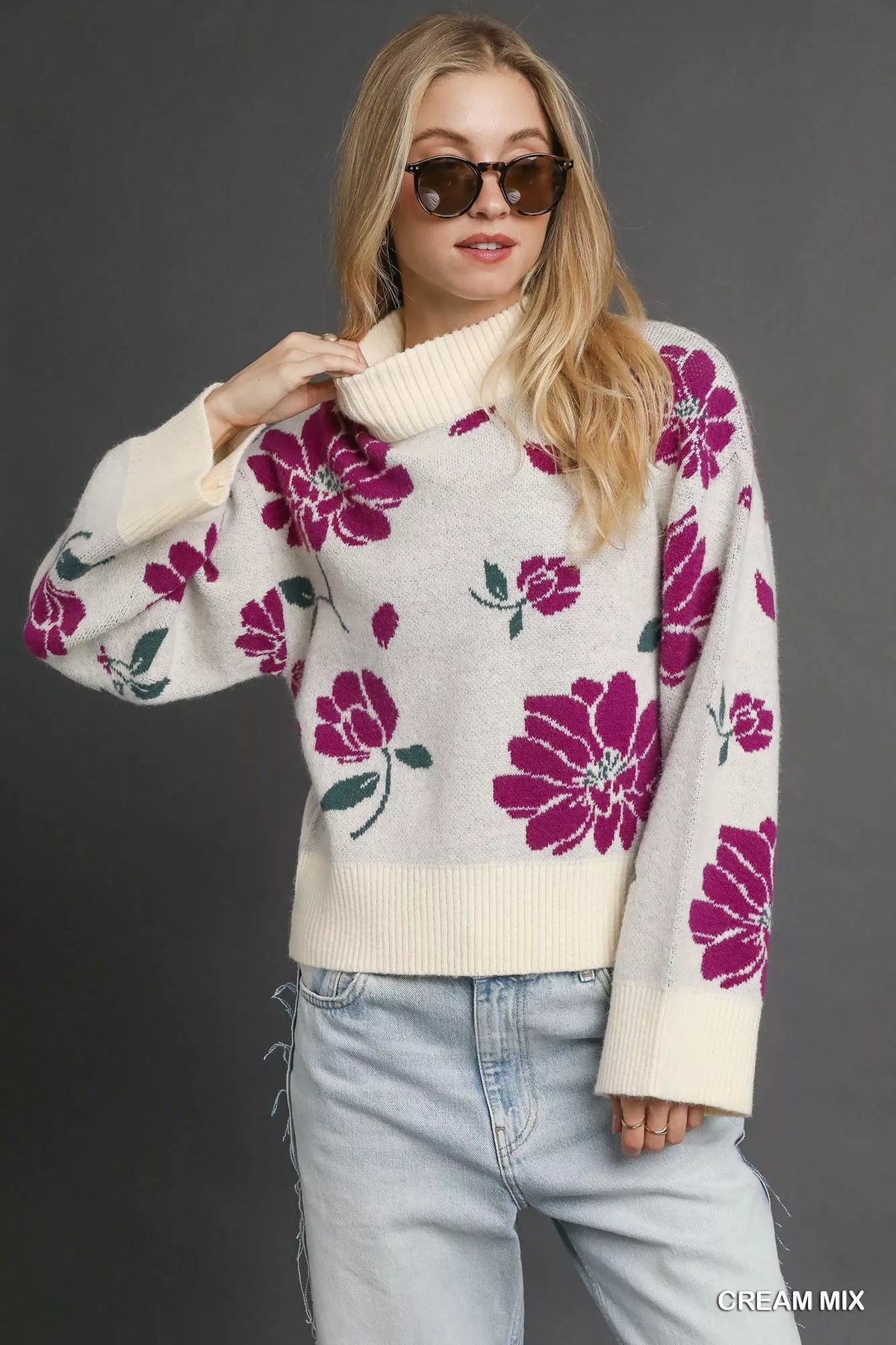 Umgee floral patterned mock neck sweater in soft knit fabric, featuring a stylish and cozy design suitable for casual wear.