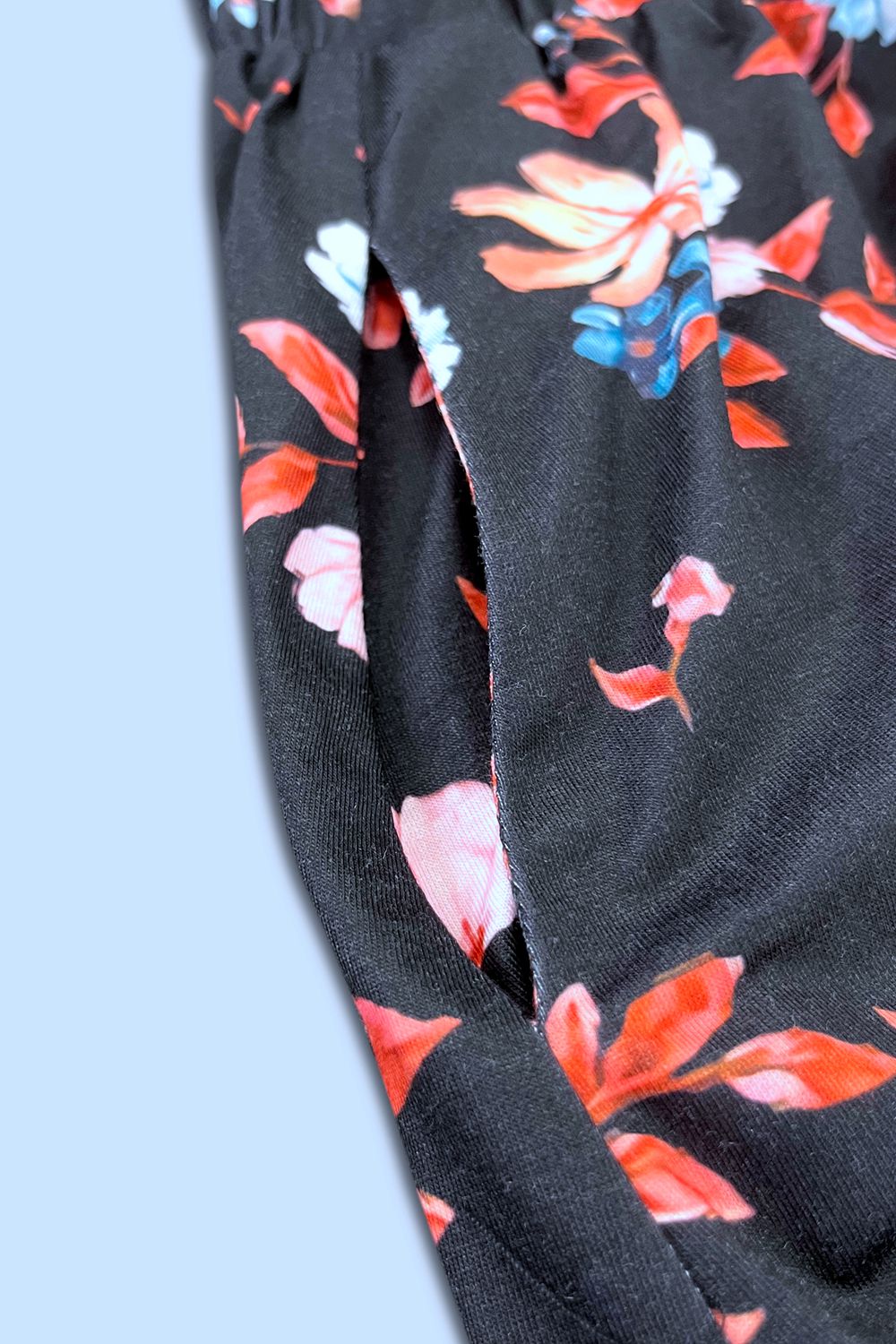 Printed sleeveless casual dress by Trendsi featuring front buttons, ruched waist, side slit, and pockets.