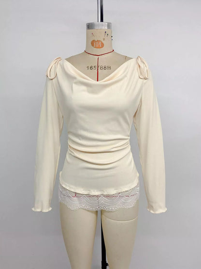 Apricot lace trim long sleeve T-shirt by Trendsi, featuring a classic fit and delicate lace accents on the sleeves.
