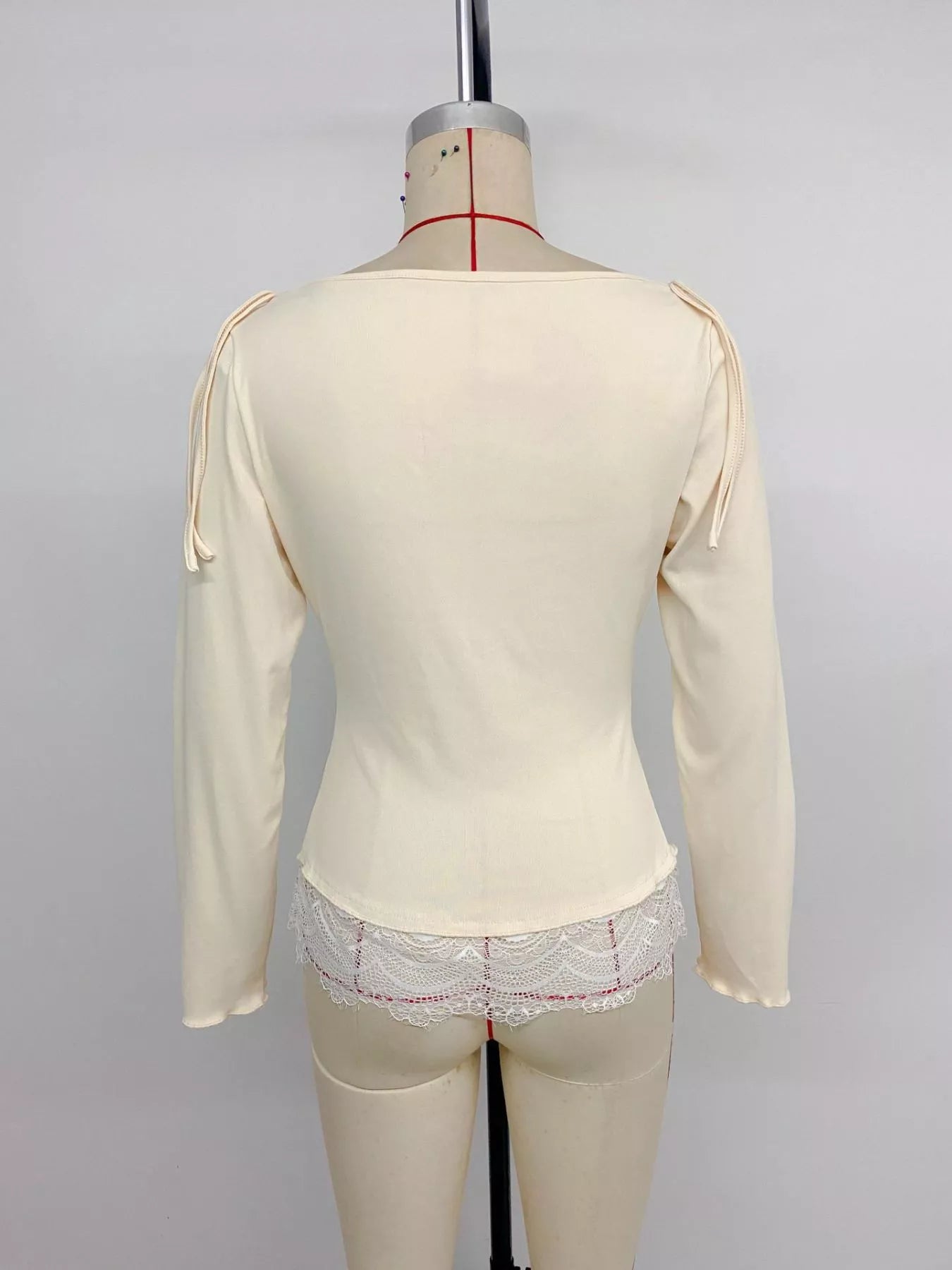 Apricot lace trim long sleeve T-shirt by Trendsi, featuring a soft fabric and delicate lace details on the sleeves.