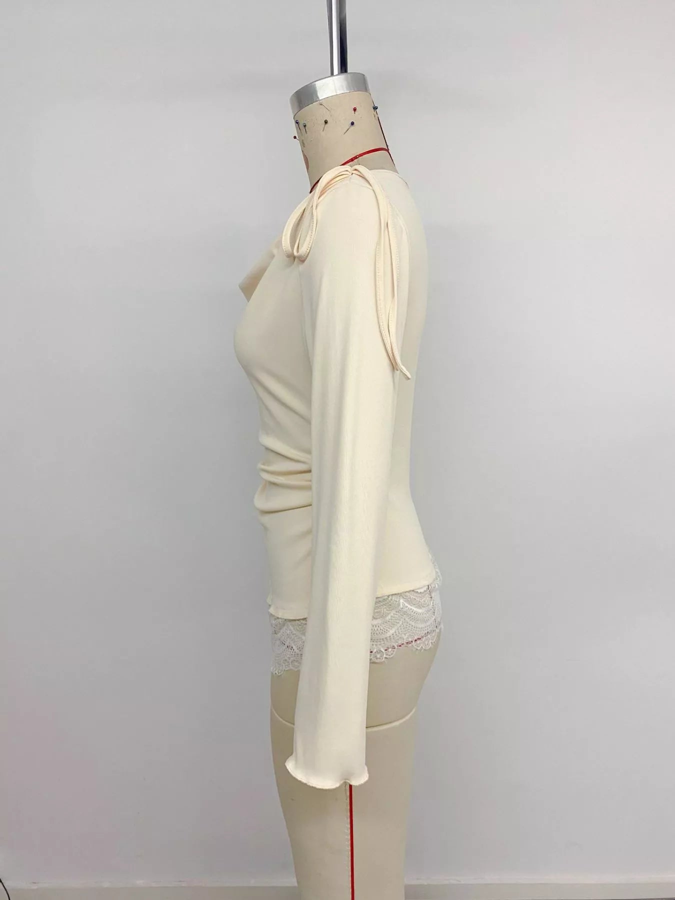 Apricot lace trim long sleeve T-shirt from Trendsi, featuring delicate lace details and a comfortable fit.