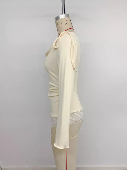 Apricot lace trim long sleeve T-shirt from Trendsi, featuring delicate lace details and a comfortable fit.