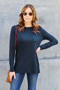 Basic Bae full size round neck long sleeve top by Trendsi, shown in black with a close-up of the soft, stretchy fabric.