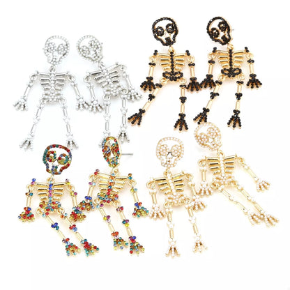 Halloween Skeleton Statement Earrings by Trendsi featuring spooky skeleton designs for festive Halloween accessories.