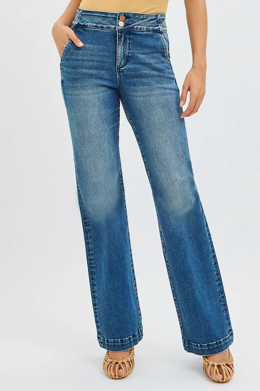 Plus size RISEN high rise bootcut jeans with tummy control and double button waistband, styled on a model.