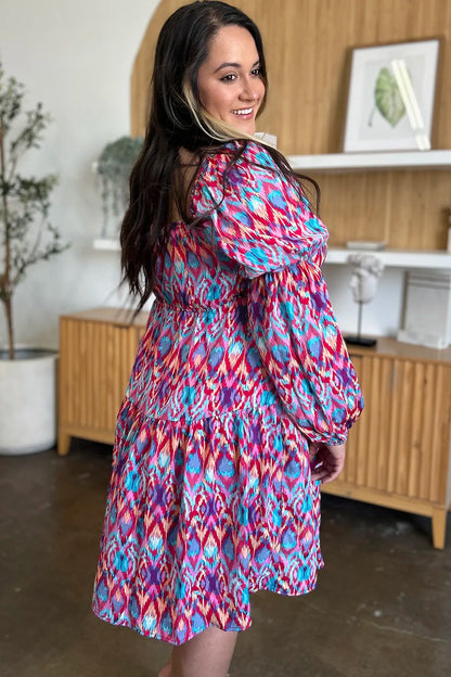 Long sleeve printed dress from Trendsi's Double Take collection, stylish full-size design with vibrant pattern.