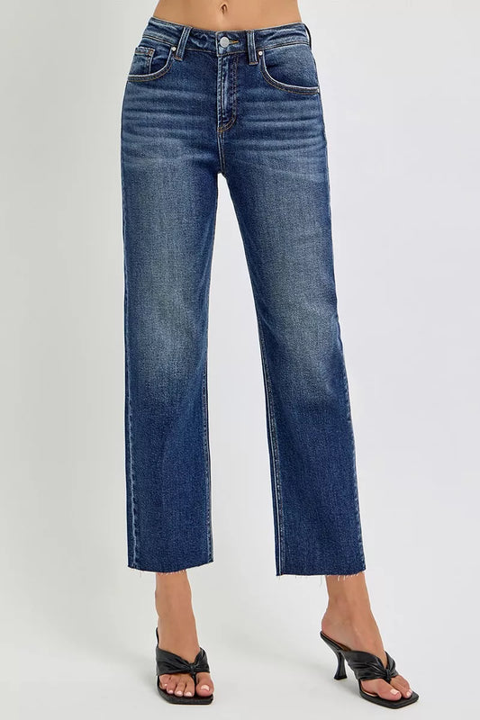 RISEN high-rise slim barrel jeans shown in dark wash denim with front pockets and tapered leg fit.