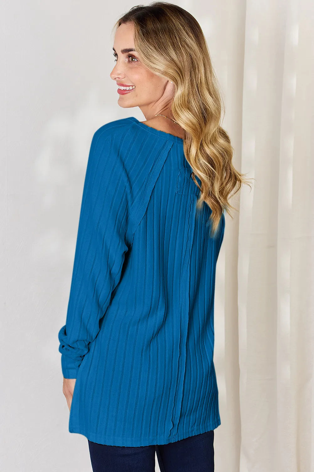 Basic Bae full size ribbed round neck slit T-shirt by Trendsi, showing the beige ribbed fabric with a round neckline and side slit detail.