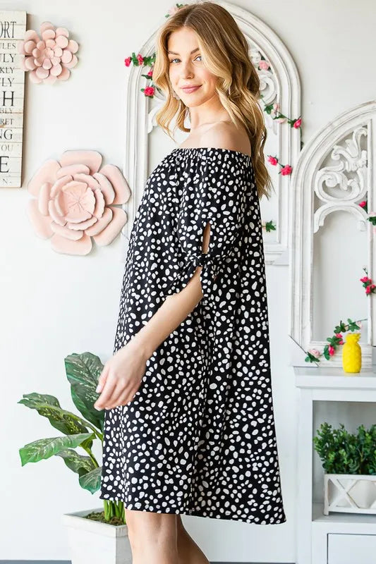 Heimish full-size short sleeve off-shoulder animal print mini dress, plus size, with a relaxed fit and stylish design.
