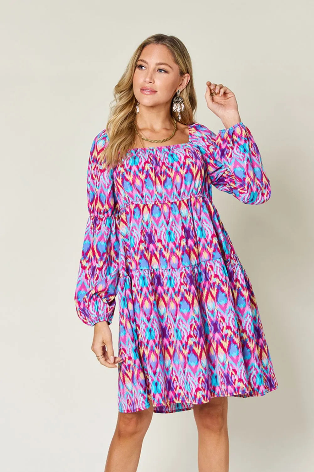 Printed long sleeve dress from Trendsi's Double Take collection, featuring a full-size, stylish design with vibrant patterns.