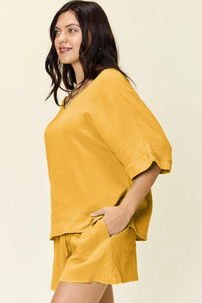 Trendsi Double Take Texture half sleeve T-shirt and drawstring shorts set, casual outfit with textured fabric and comfortable fit.