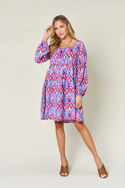 Long sleeve printed dress from Trendsi's Double Take collection, featuring a full-length design with stylish pattern.