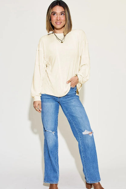 Basic Bae full size ribbed long sleeve T-shirt with round neck by Trendsi, featuring a close-up of the ribbed knit fabric and fit.