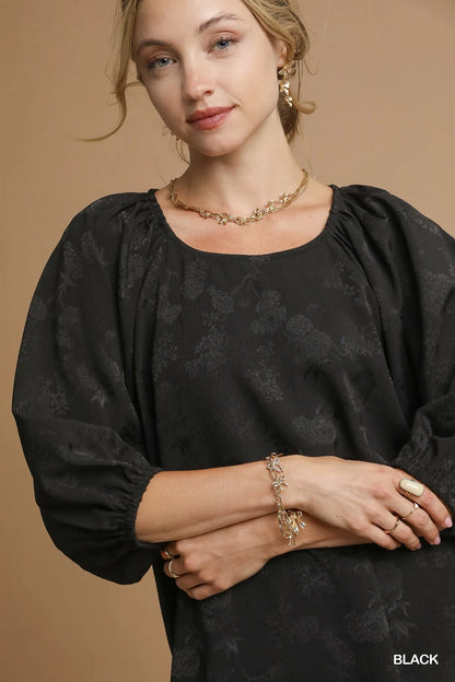 Umgee satin jacquard balloon sleeve blouse with a relaxed fit and elegant design, featuring intricate patterns and a soft sheen.