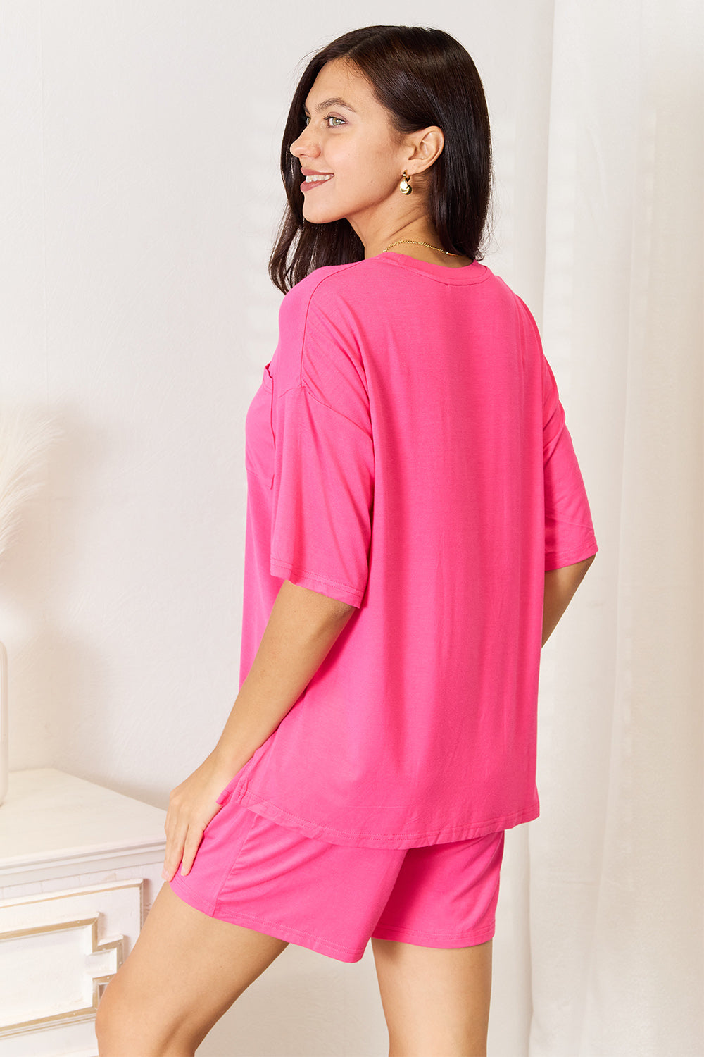 Basic Bae full-size soft rayon half sleeve top and shorts set by Trendsi, featuring a relaxed fit and comfortable fabric.