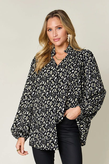 Plus size leopard print long sleeve blouse by Trendsi featuring a stylish double take full-size design.