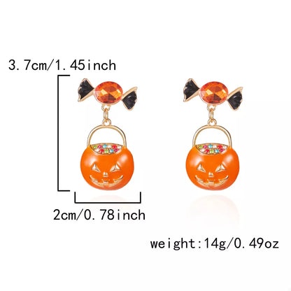 Halloween Rhinestone Pumpkin Dangle Earrings featuring sparkling pumpkin design and silver hooks, perfect for festive fall styling.