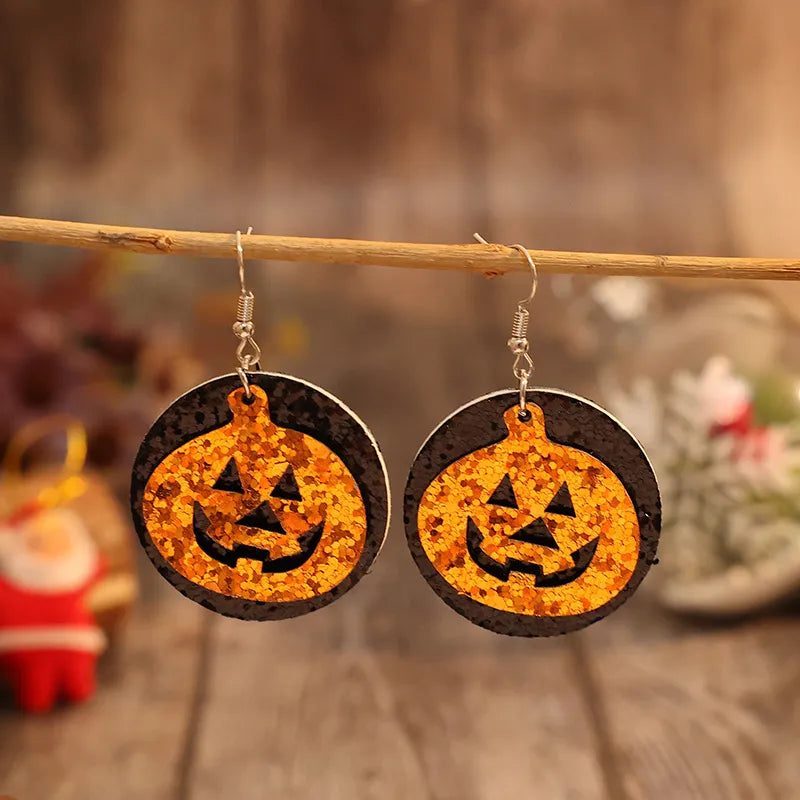 Trendsi PU leather pumpkin earrings with orange and black design, perfect for fall and Halloween accessories.