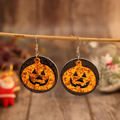 Trendsi PU leather pumpkin earrings with orange and black design, perfect for fall and Halloween accessories.