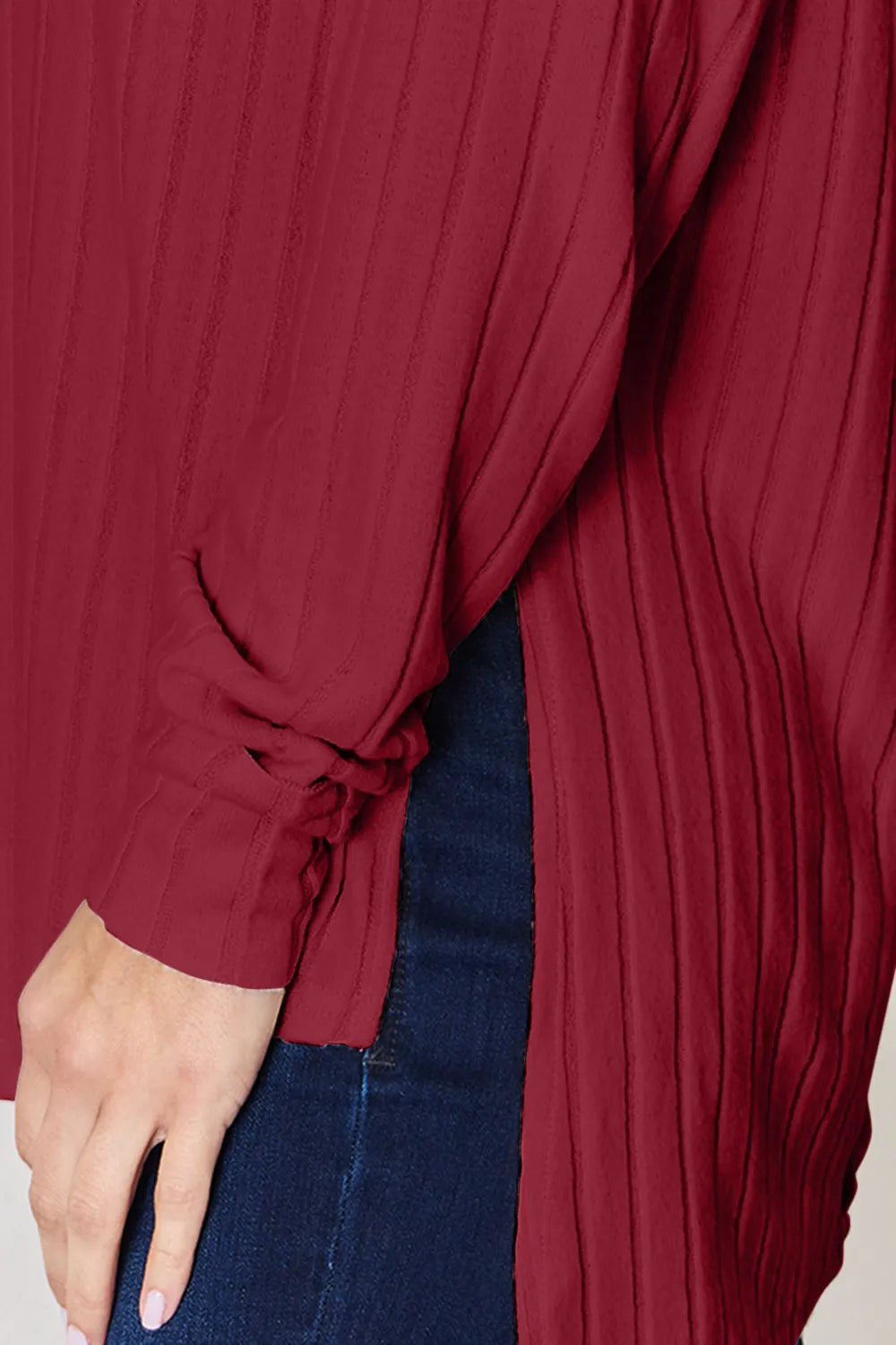 Basic Bae full size ribbed round neck slit T-shirt by Trendsi, featuring a ribbed fabric and a stylish slit detail at the hem.