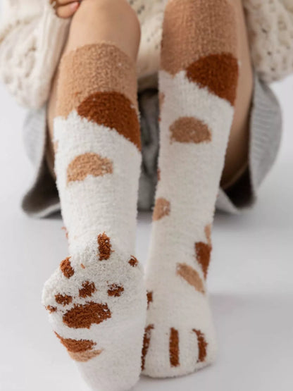 Fuzzy knee-high animal paw socks by Trendsi, featuring soft plush fabric and paw print design for cozy, cute footwear.
