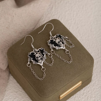 Halloween alloy heart skull earrings with chain detail, featuring gothic-inspired design and dark metallic finish.