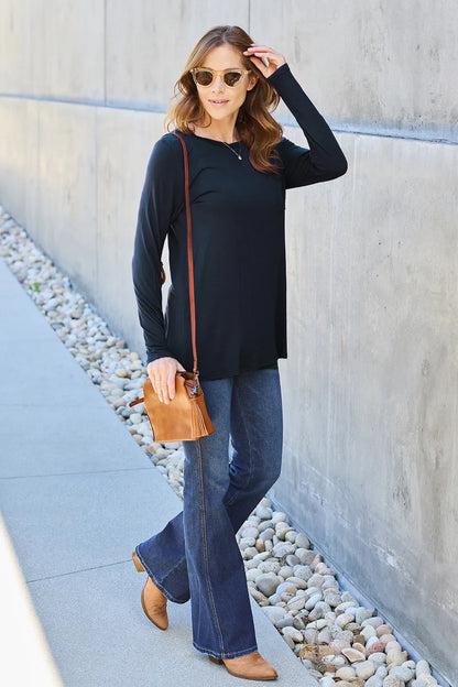 Basic Bae full size round neck long sleeve top by Trendsi, showcasing a comfortable, casual long sleeve shirt in a neutral color.