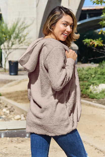 Full size Teddy hooded jacket with pockets, soft plush fabric, and cozy design by Trendsi, shown in a front view.