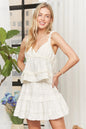 Beige ruffled tiered crop top by Trendsi featuring layered fabric and a stylish, feminine design.