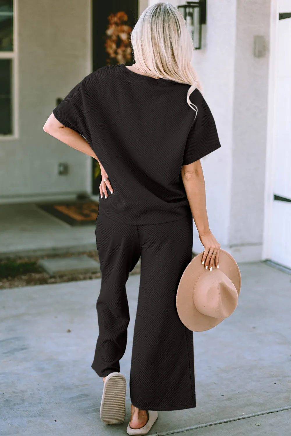 Trendsi Double Take full size textured short sleeve top and matching pants set, stylish casual clothing for women.