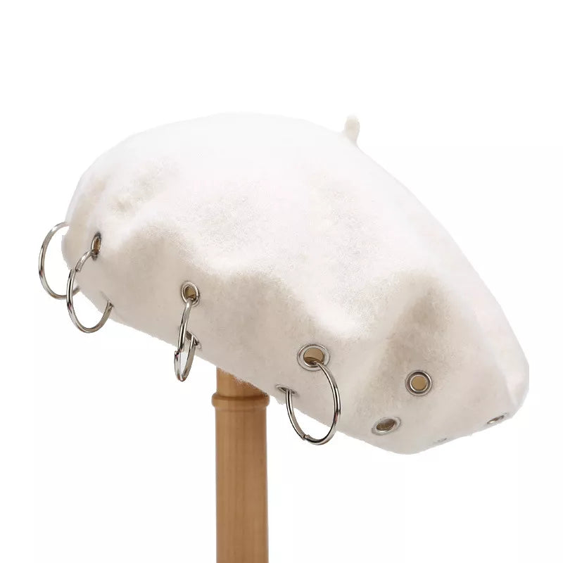Metal ring embellished beret hat from Trendsi, showcasing a stylish black wool beret with metallic ring details.
